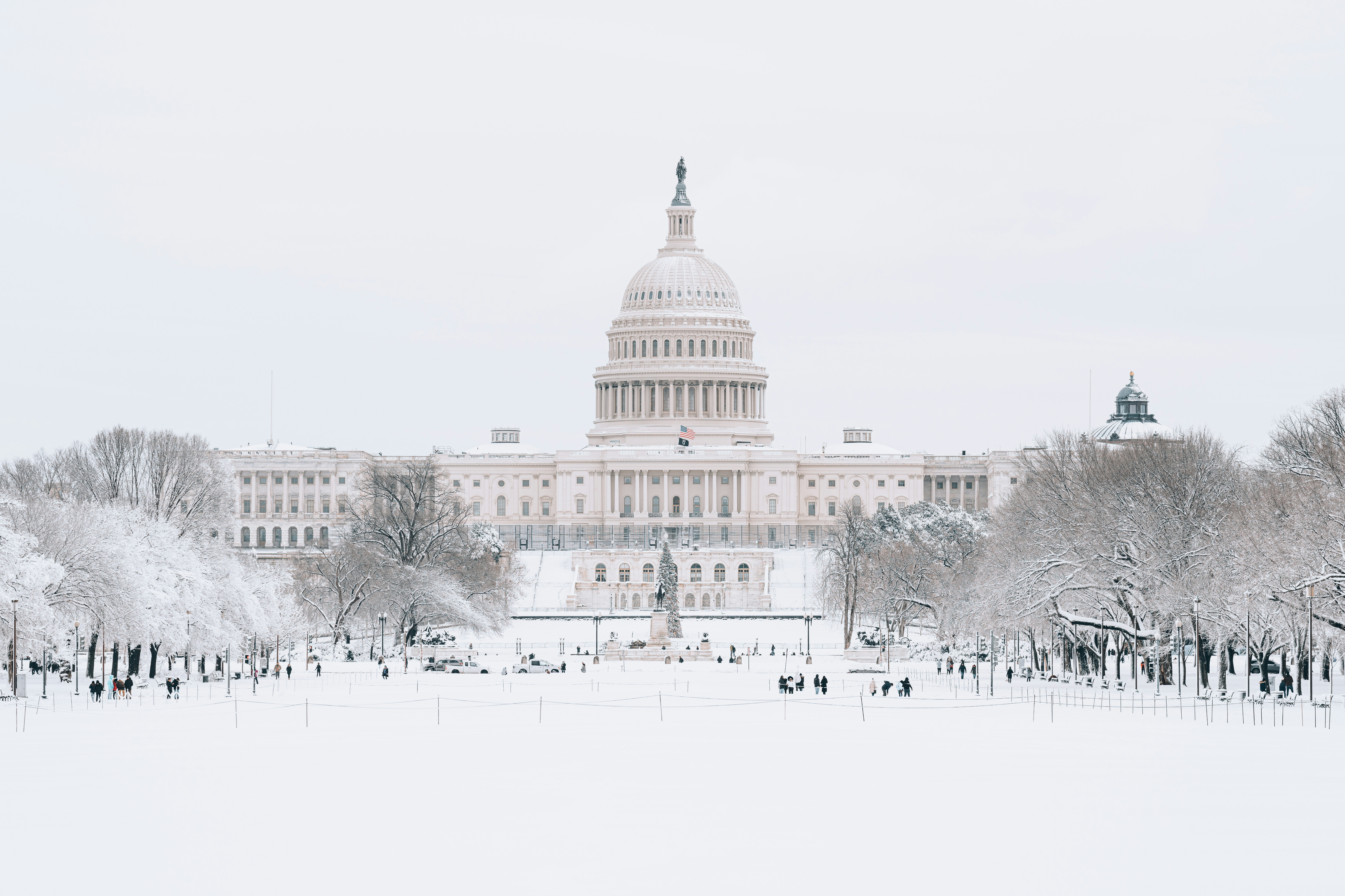US Capitol Building with lawn covered in snow